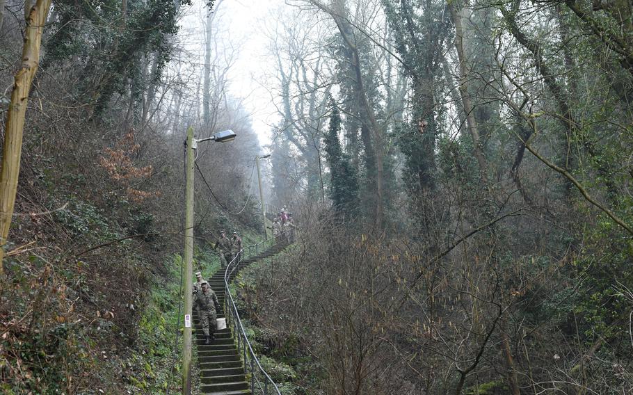 U.S. and German soldiers made several trips down roughly 250 steps, while carrying buckets of cement, to help with repair work in St. Goar, Germany, on Feb. 23, 2023.