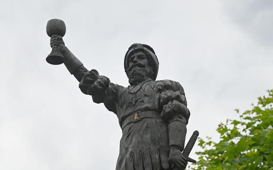 A nobleman with sword and wine glass tops the fountain on Ruedesheims market square. The town is in the center of the Rheingau, probably Germanys best-known wine-producing region, with its famous rieslings.