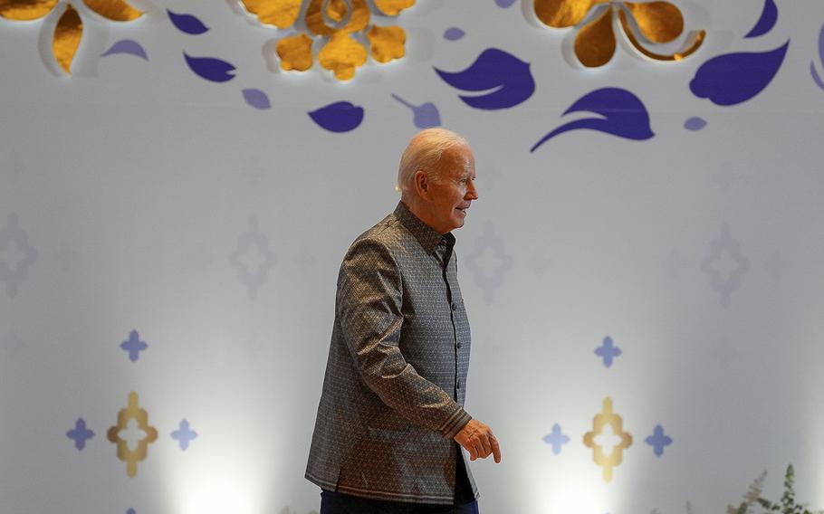 President Joe Biden walks on stage in Phnom Penh, Cambodia, where he was to meet leaders from the Association of Southeast Asian Nations on Saturday, Nov. 12, 2022. 