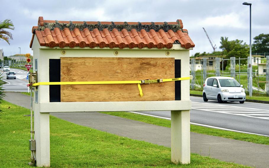 An outdoor digital sign at Camp Foster, Okinawa, is secured ahead of Typhoon Hinnamnor, Thursday, Sept. 1, 2022. 