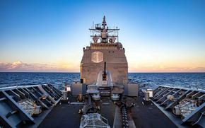 The guided-missile cruiser USS Chancellorsville sails in the South China Sea, Tuesday, Nov. 29, 2022.