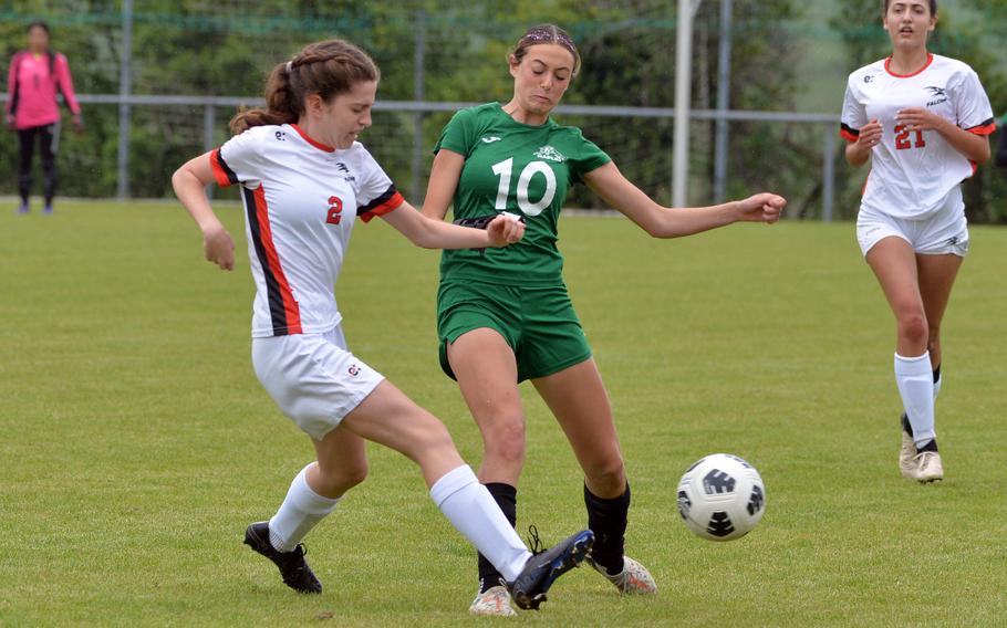 AOSR’s Evelyn Campbell clears the ball from Naples’ Emerson Shorey in a Division II game at the DODEA-Europe soccer finals at Reichenbach-Steegen, Germany, May 21, 2024. Naples won 6-0.