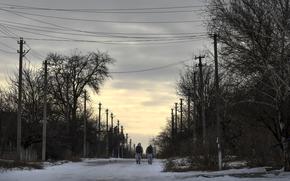 Ukrainian servicemen patrol a street toward the frontline with Russia-backed separatists in Verkhnotoretske village in Yasynuvata district, Donetsk region, eastern Ukraine, Saturday, Jan. 22, 2022.  