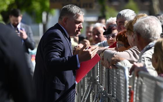 Slovakia's Prime Minister Robert Fico speaks with people in the town of Handlova on May, 15, 2024, before being shot and injured in an apparent assassination attempt.
