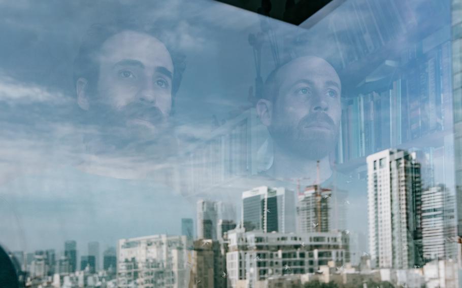 Yonatan Zeigen, left, and his brother Chen — the sons of Vivian Silver, who was kidnapped by Hamas from Kibbutz Beeri on Oct. 7, 2023 — in Yonatan’s apartment in Tel Aviv on Oct. 27. 