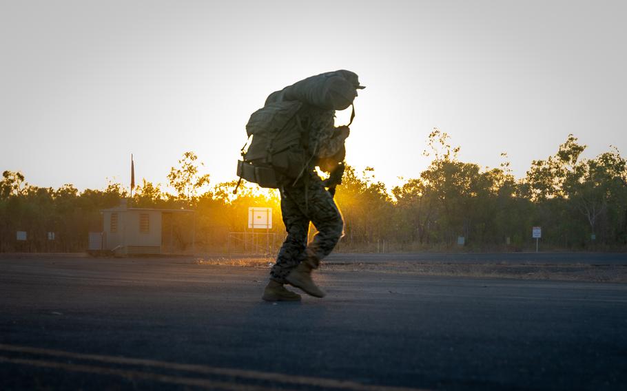 A Marine rushes across a runway during an airfield seizure exercise at Mount Bundey Training Area, NT, Australia, in July 2021. The exercise implemented concepts of Force Design 2030, the ten-year plan to reshape the Marine Corps for the force of the future.