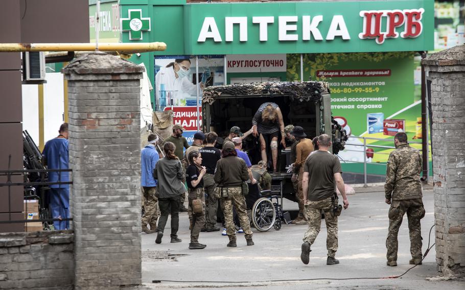 A wounded female civilian arrives in a military ambulance to a hospital in eastern Ukraine on May 29, 2022. 