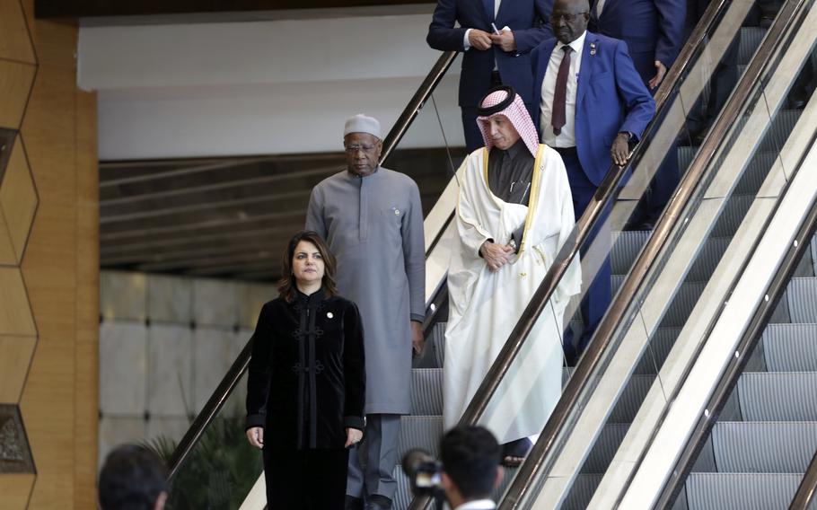 Libya’s Tripoli-based administration Foreign Minister Najla Mangoush descends an escalator during a meeting with other Arab chief diplomats in the capital of Tripoli, Sunday, Jan. 22, 2023. She is followed by Special Representative of the UN Secretary General to Libya Abdoulaye Bathily, and representatives from Qatar and Sudan. The gathering was boycotted by other Foreign Ministers who do not recognize the mandate of the Tripoli-based government.