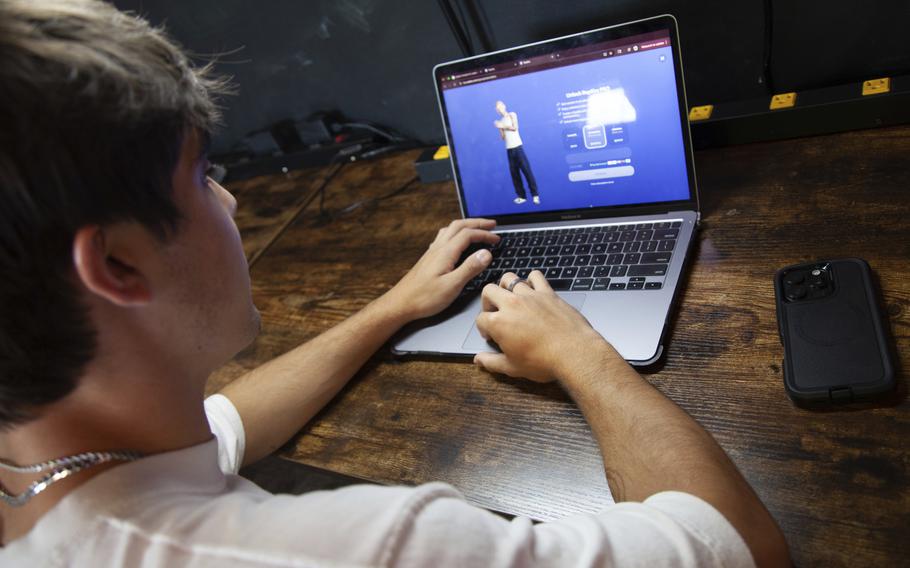Teen on a laptop using an AI companion. 