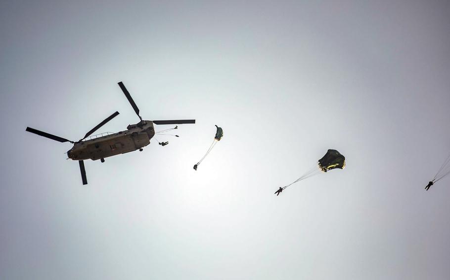 Soldiers from the U.S. Army's 1st Special Forces Group and the South Korean army's 7th Special Forces Brigade parachute out of a CH-47 Chinook during Ulchi Freedom Shield in Iksan, South Korea, March 5, 2023.