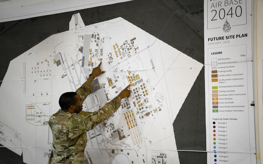 Maj. Samuel Richardson, construction management chief at the Ninth Air Force (Air Forces Central) program management office, points to the location of two dining facilities  one new and one old  at Al Udeid Air Base, Qatar, April 22, 2022.