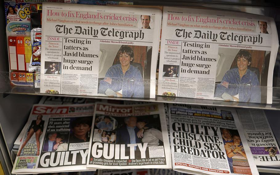 A selection of headlines from British newspapers is pictured in a store in London on Dec. 30, 2021, the morning after a jury in New York found Ghislaine Maxwell guilty of recruiting and grooming young girls to be sexually abused by the late American financier Jeffrey Epstein. 