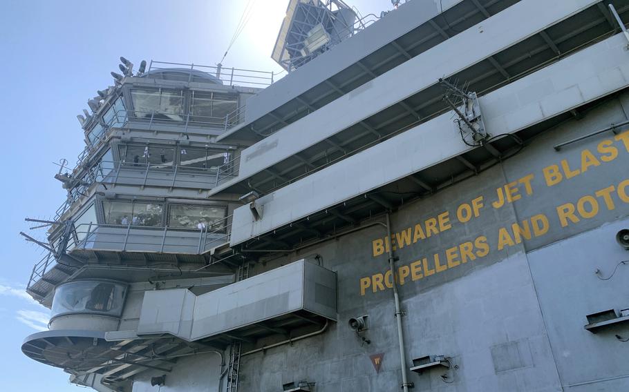 The aircraft carrier USS Ronald Reagan docks in Busan, South Korea, Friday, Sept. 23, 2022.