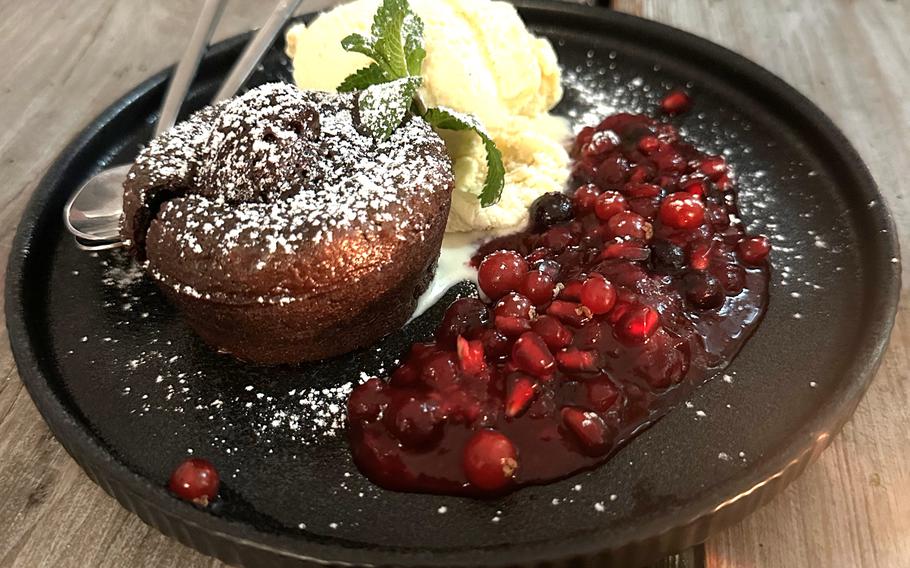 Das Notstain's desserts include chocolate lava cake with vanilla ice cream and berry mix, shown above, and mango tapioca.