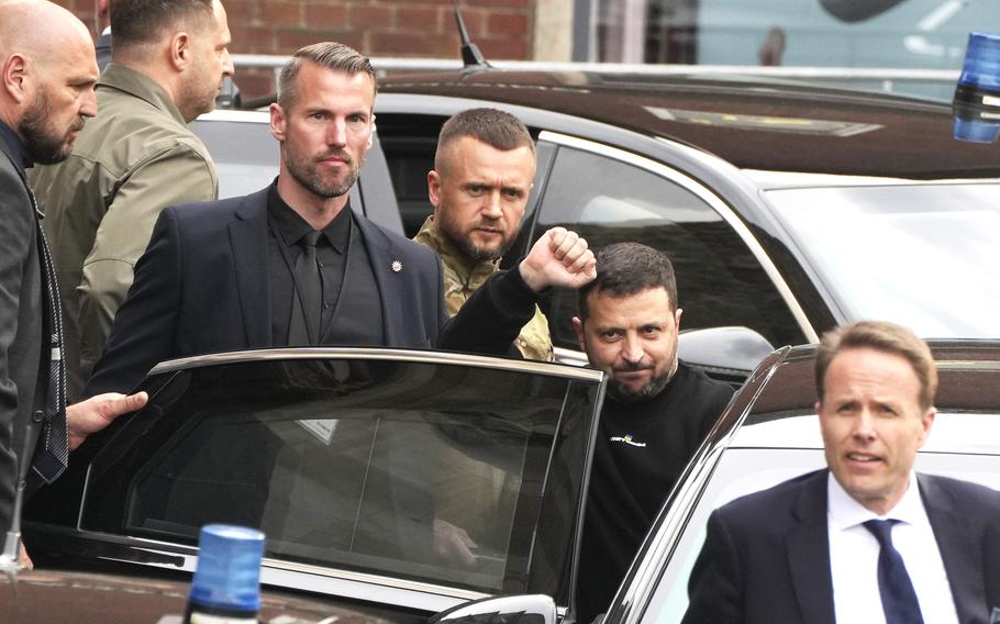 Ukraine President Volodymyr Zelenskyy, second from right, leaves after receiving the International Charlemagne Prize in Aachen, Germany, May 14, 2023. 