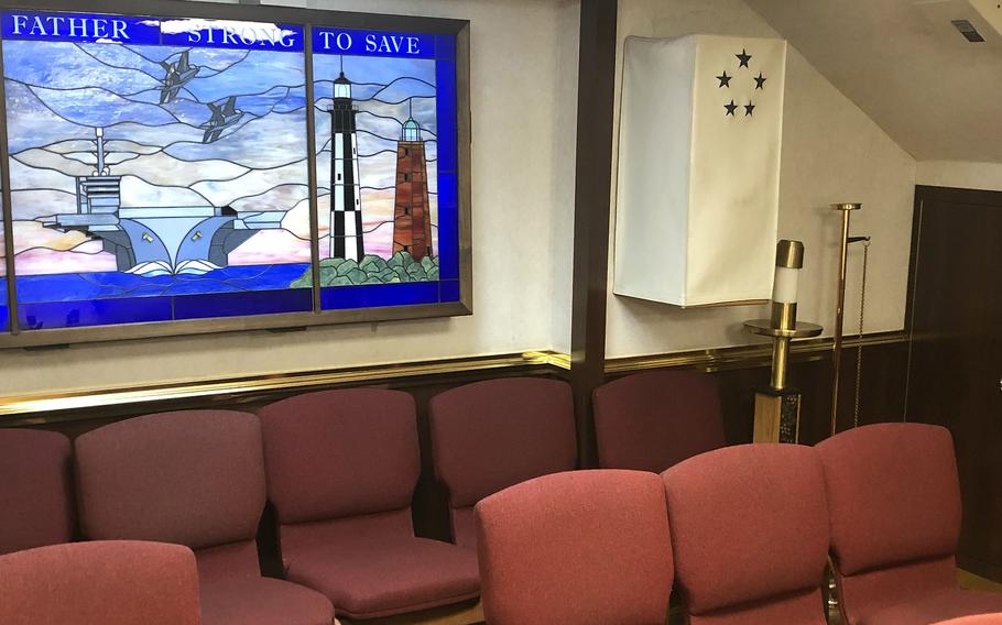 A Torah donated to the aircraft carrier USS Dwight D. Eisenhower is housed in a wooden cabinet, or ark, in the ship's chapel. When not in use, the ark is covered by a white protective fabric case adorned with the ship's signature crest representing Eisenhower's five-star general rank. The Torah is the written text of Jewish law and teachings, including the Bible, and is considered to be the most sacred text of Judaism.