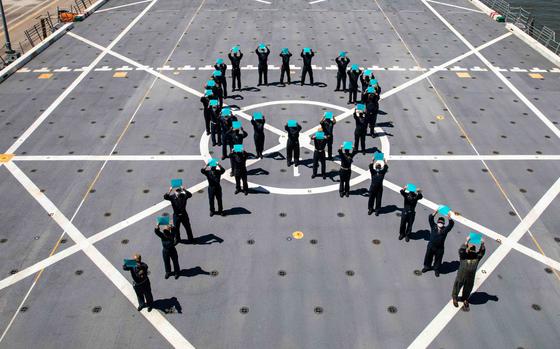 Sailors assigned to USS Arlington form a teal ribbon on the flight deck April 26, 2021, to mark Sexual Assault Awareness Month. A Navy administrative order released Feb. 7, 2024, allows sailors to make confidential reports of sexual assaults without triggering an investigation or disciplinary action.