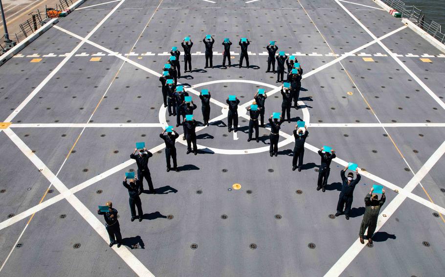 Sailors assigned to USS Arlington form a teal ribbon on the flight deck April 26, 2021, to mark Sexual Assault Awareness Month. A Navy administrative order released Feb. 7, 2024, allows sailors to make confidential reports of sexual harassment without triggering an investigation or disciplinary action.