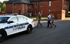 MSgt. Adrienne Clark being escorted after her court martial Satruday at RAF Mildenhall. Clark has been sentenced to 32 months confinement, reduction to E-1 and dishonorable discharge after being found guilty of various UCMJ violations including possession of child pornography and sexual abuse of a child. 