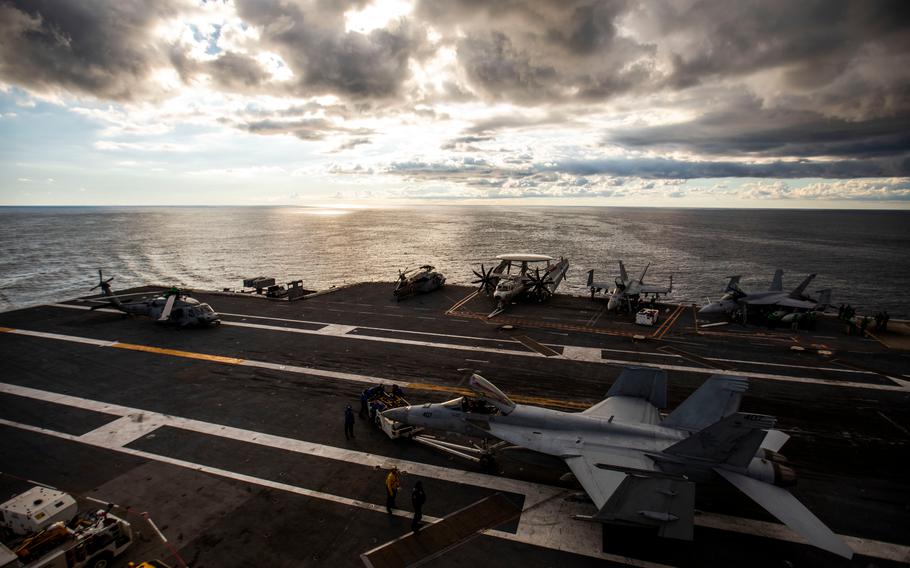 Planes and helicopters are seen on the flight deck of the USS Gerald R. Ford in the Atlantic Ocean on Friday, Oct. 7, 2022. The Ford is the Navy’s newest and most technologically advanced warship.