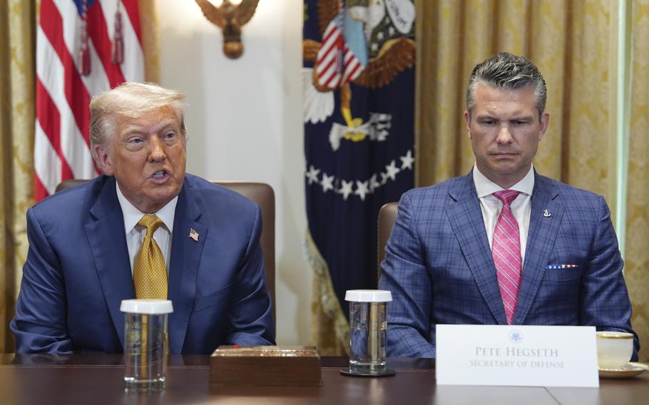President Donald Trump, left, with Defense Secretary Pete Hegseth, right, during a cabinet meeting