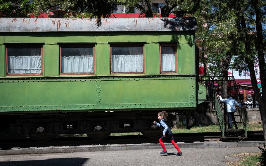 Children play at a park by the Stalin Museum in Gori, Georgia, on May 18. Joseph Stalin took the green rail coach to the World War II conference with the Allied leaders in Tehran. 