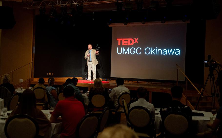 Will Penner speaks on stage during a TEDx event.