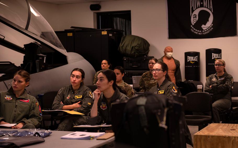 Airmen are briefed Feb. 13, 2023, before the first ground test of a new in-flight bladder relief system at Seymour Johnson Air Force Base, N.C. The base is the first to ground-test the Airion Health system for female pilots.