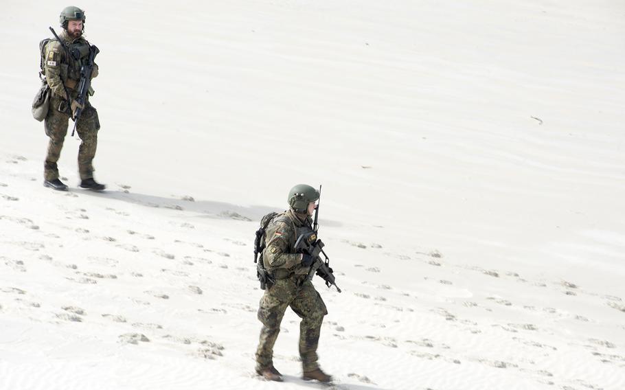 German sailors cross Langham Beach during an amphibious assault near Stanage Bay, Australia, Wednesday, Aug. 2, 2023. The training alongside U.S. Marines was part of the Talisman Sabre exercise. 