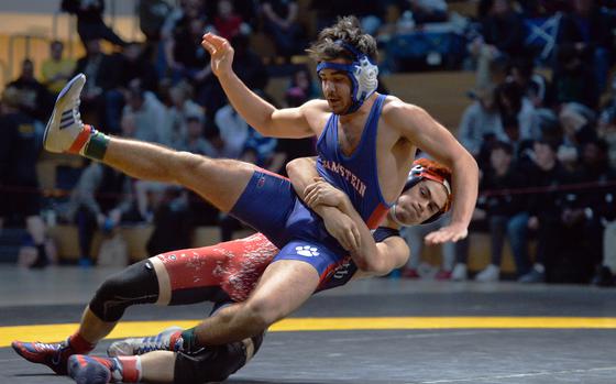 Lakenheath’s Lucius Bowman pulls down Ramstein’s Nathan Rutlege on his way to winning the 157-pound title at the DODEA-Europe wrestling championships, in Wiesbaden, Germany, Feb. 11, 2023. 