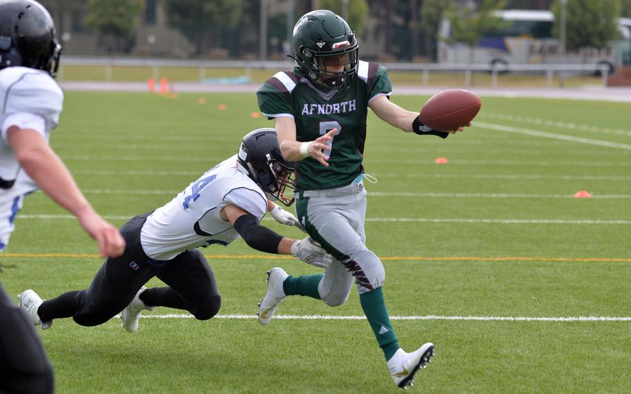 AFNORTH quarterback David Immel reaches the ball over the goal line after evading Jaiden Workman of Hohenfels in the Lions’ 76-28 win over the Tigers in a Division III game played at Kaiserslautern High School, Saturday, Sept. 11, 2021.