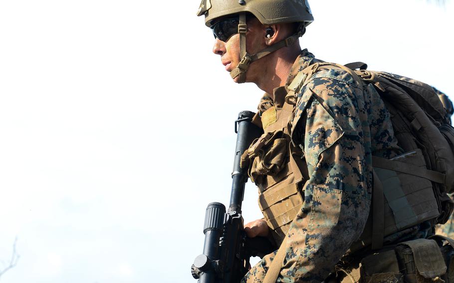 A Marine infantry student at Camp Lejeune, N.C., practices setting up an ambush in a live-fire training event Aug. 27, 2021, during their 12th week of initial infantry training as part of a pilot program meant to drastically change the way the Corps trains its infantrymen. The pilot program expands infantry training from nine to 14 weeks and places Marines in 14-person squads under a single instructor.