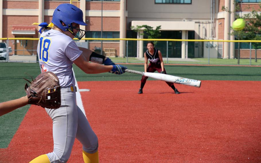 Yokota's Claire Smith connects against Perry.