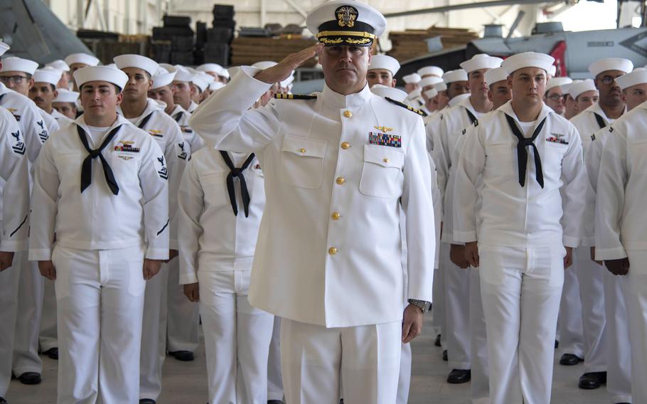 Sailors stand at attention during a change of command ceremony in Norfolk, Va., in 2017. For now at least, U.S. Navy sailors generally will remain clean-shaven.