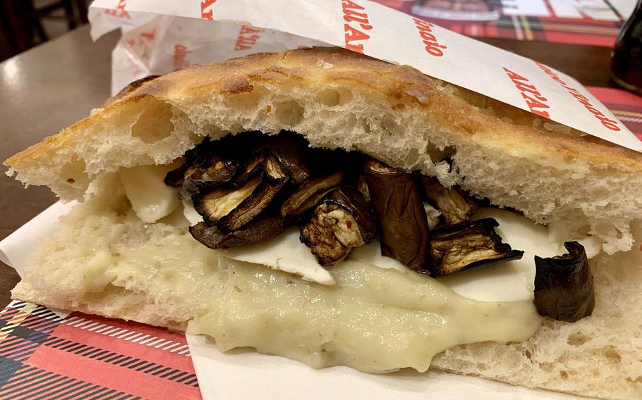 Vegetarian Italian sandwich filled with vegetables and cheese.