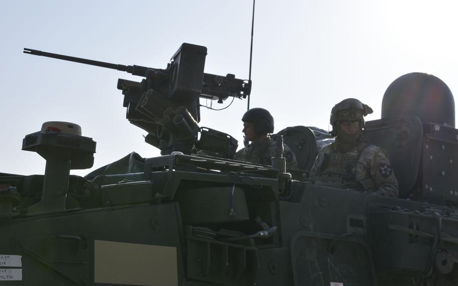 Soldiers from 8th Squadron, 1st Cavalry Regiment, 2nd Stryker Brigade Combat Team conduct a radio check as they prepare for a live-fire exercise at Rodriguez Live Fire Complex in Pocheon, South Korea, Tuesday, Jan. 10, 2023.