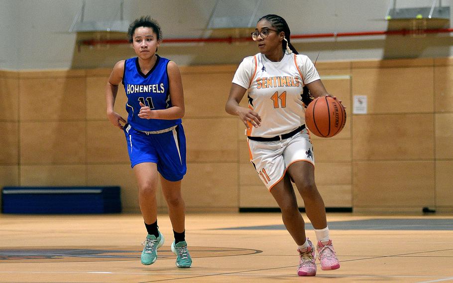 Spangdahlem's Gabrielle Schmidt dribbles up the floor during a basketball game against Hohenfels on Jan. 26, 2024, at Spangdahlem High School in Spangdahlem, Germany.