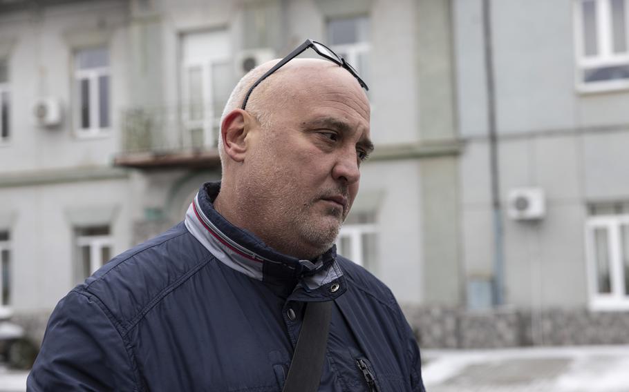 Dmytro Matiukha stands outside the morgue in Kherson, Ukraine, on Monday. His mother-in-law, Tetiana Svitlova, died while trying to cross the Dnieper River. 