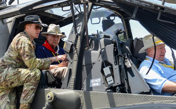Army Warrant Officer 1 Bobby Keen, an AH-64 Apache pilot, shows Vietnam War pilots around the inside of an Apache on April 25, 2025 during a reunion of 3rd Squadron, 17th Cavalry Regiment troopers who served in Vietnam. The Vietnam veterans spent time with current members of their old unit, including Keen, which is now stationed at Hunter Army Airfield in Savannah, Ga. (Corey Dickstein/Stars and Stripes)
