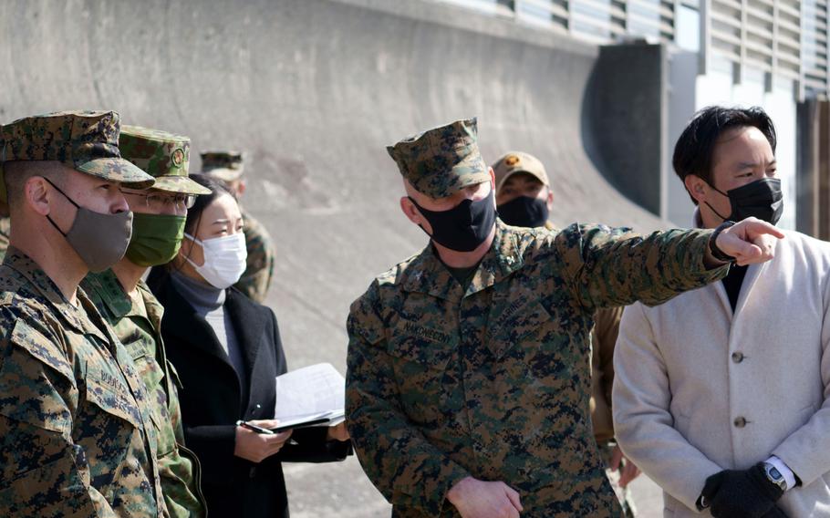 Col. Michael Nakonieczny, commander of the 31st Marine Expeditionary Unit, observes an amphibious landing alongside Japan Ground Self-Defense Force officers and Numazu Mayor Shuichi Yorishige at Numazu Beach Training Area, Japan, March 9, 2022. 