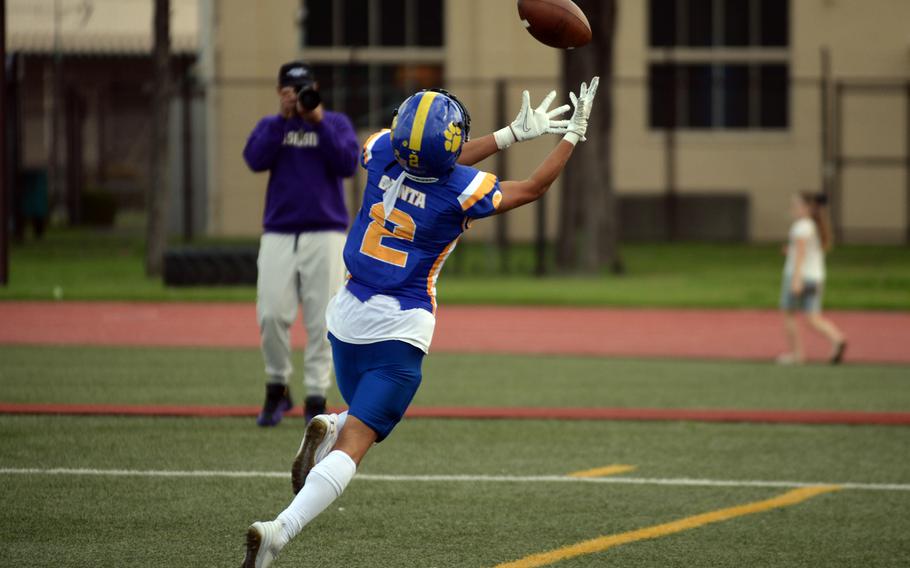 The ball flies just out of the reach of Yokota receiver Royce Canta.