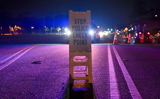 A sign identifies a DUI checkpoint.