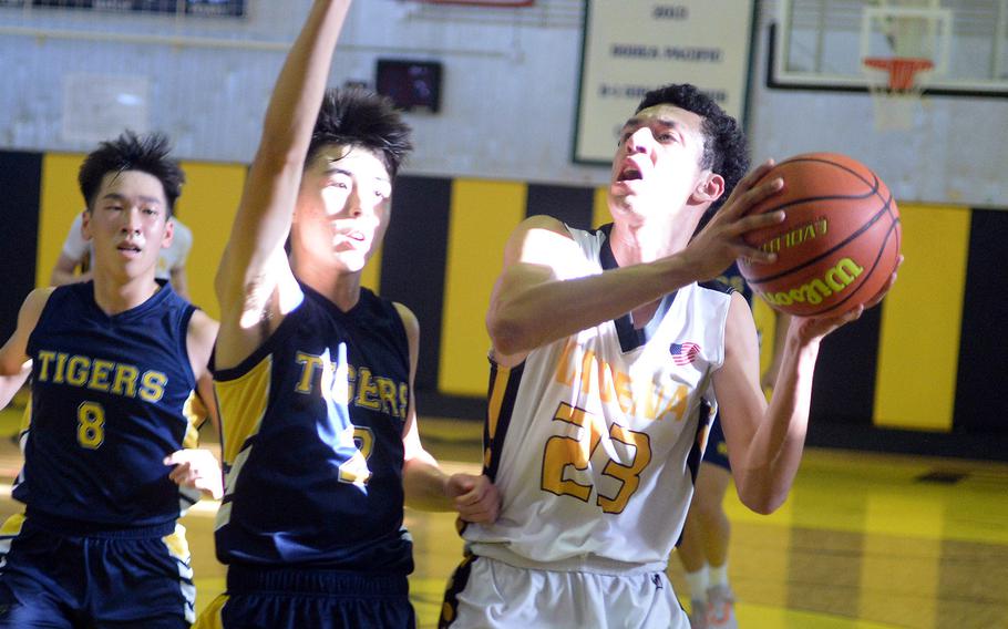 Kadena senior Derick Santiago, right, will suit up next winter for the Maine Maritime Academy Mariners of the Division III North Atlantic Conference on partial scholarship.