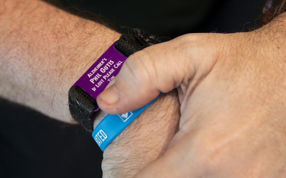 Phil Gutis wears an identification bracelet in case he gets lost from his home in New Hope, Pa.