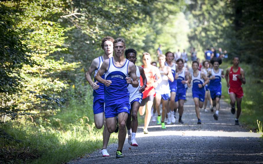 Gideon Zaugg, 17, a senior at Ramstein, bolts out in front of the pack during the beginning of a high school boys’ varsity cross country race Saturday, Sept. 18, 2021, in Kaiserslautern, Germany.