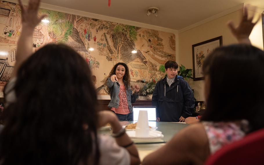 Georgetown University volunteer Angelina Torres calls on a child in a banquet room at Panda Gourmet restaurant during a tutoring session. The university's DC Schools Project helps about 30 Latin American migrant children and teenagers practice English. 