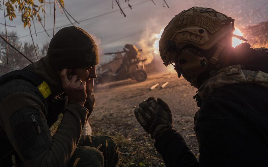 Ukrainian service members fire toward Russian positions in the frontline near Kherson, southern Ukraine, Wednesday, Nov. 23, 2022. 