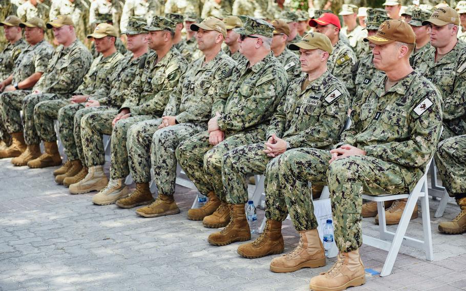 Sailors and Marines attend a memorial service Wednesday, April 24, 2024, at Naval Support Activity Bahrain in honor of three USS Firebolt service members killed in a 2004 attack.