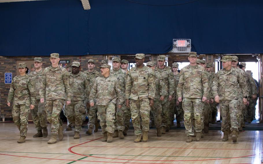 Soldiers of 2nd Stryker Brigade Combat Team, 4th Infantry Division, march into the Fort Carson Special Events Center during a welcome home and uncasing ceremony at Fort Carson, Colo., Tuesday, March 5, 2024. Families gathered at the SEC to greet their soldiers after a nine-month deployment to South Korea training alongside Republic of Korea soldiers.