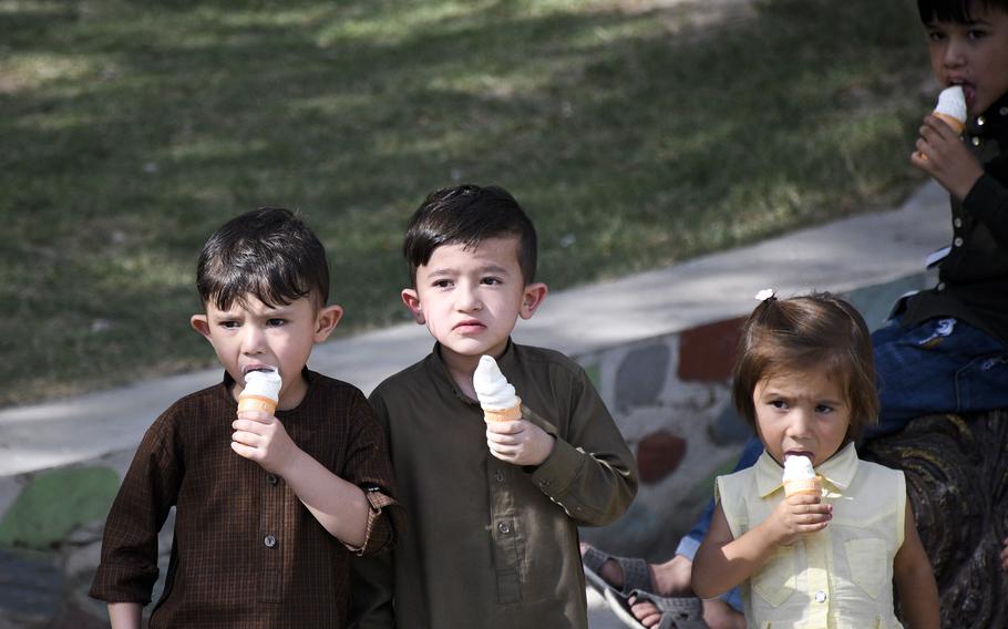 Children enjoy ice cream cones at the Kabul Zoo in Afghanistan on Aug. 12, 2021, just days before the city fell to the Taliban. 